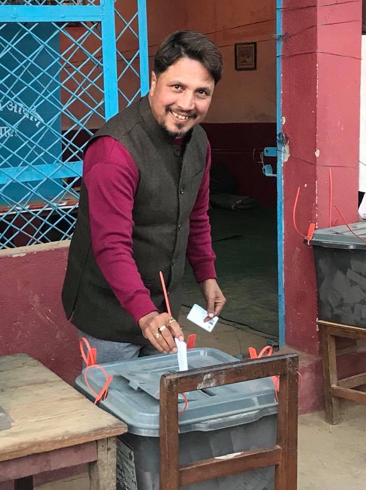 Deepak Raj Giri voting during election