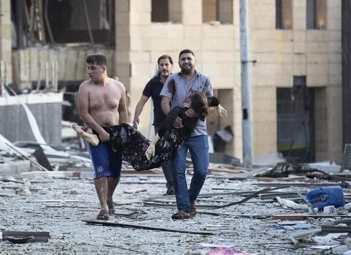 people carrying a wounded casualty